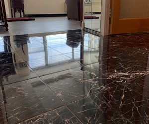 Black marble floor restoration  in Downtown Chicago
